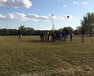 Teaching how to kick in the Flag Football Camp