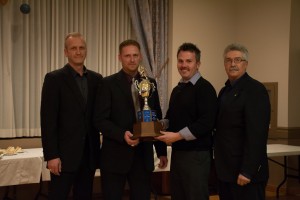 Greg Tyszka, Ryan Branting, and John Wojcicki accepting the award on Brad's behalf
